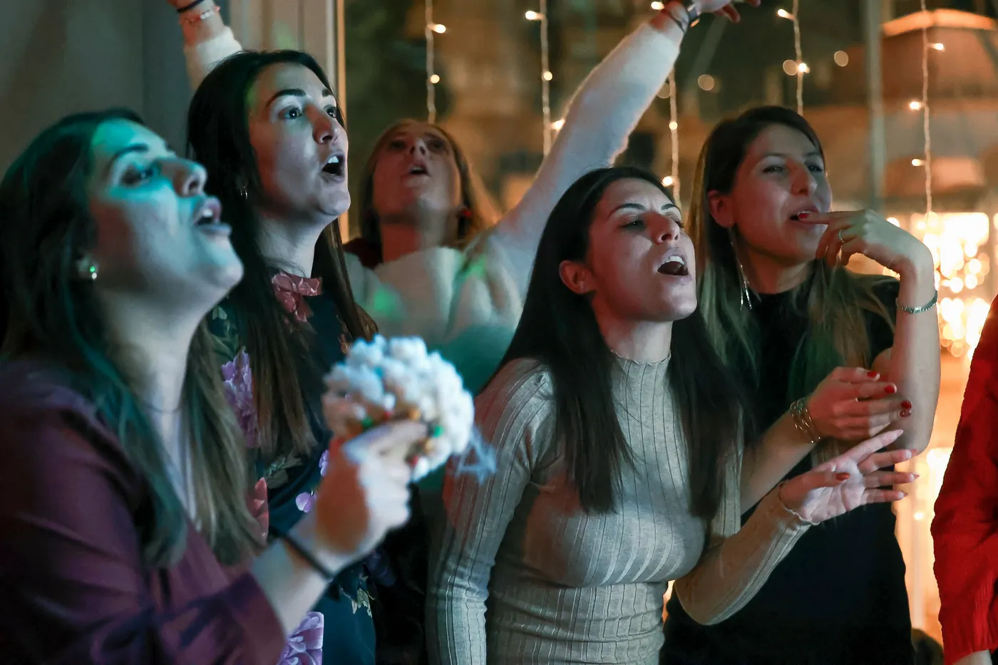 Friends singing their hearts out in a karaoke room