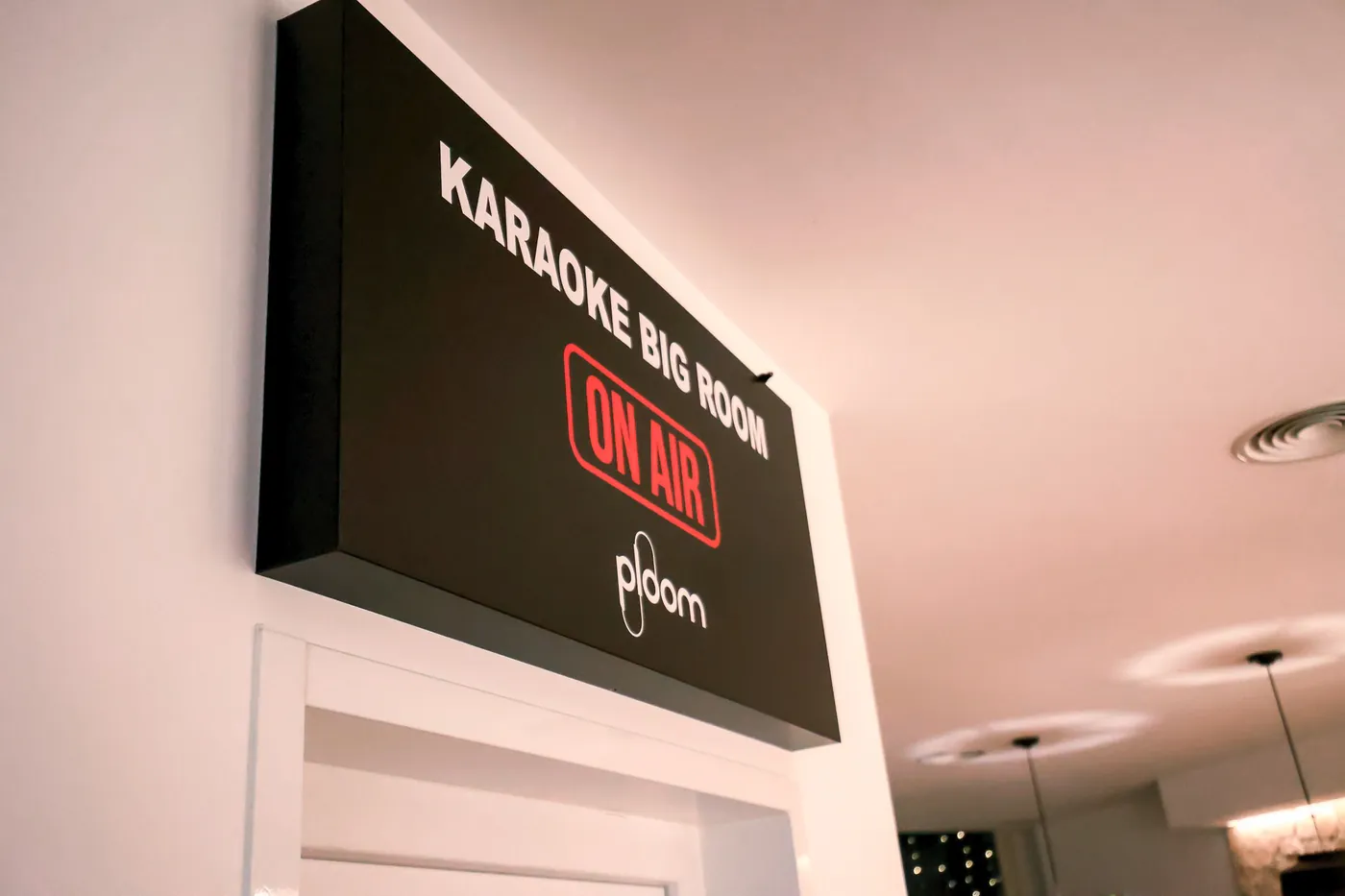 The Karaoke Big Room On Air sign above the door